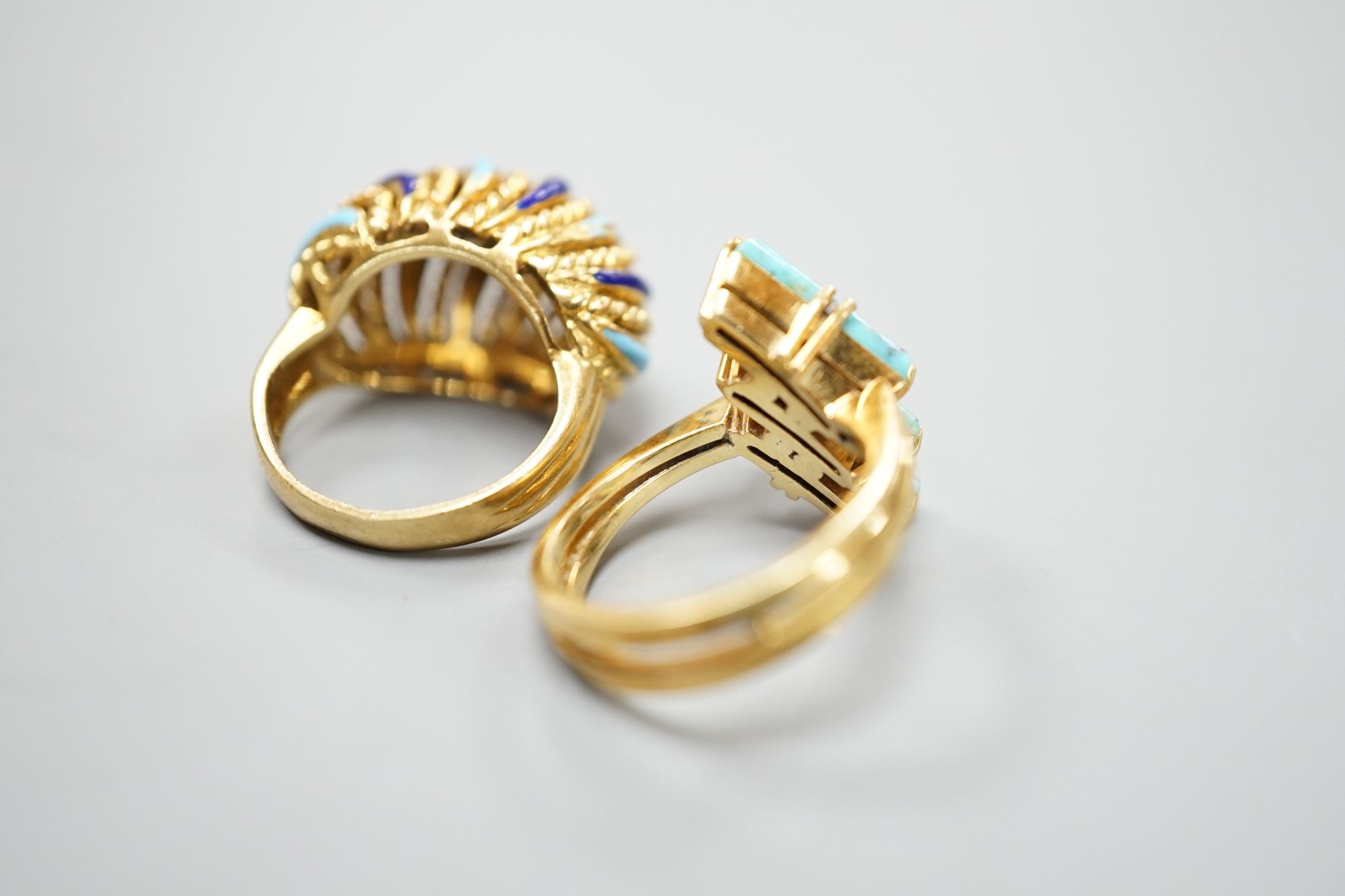 An Italian yellow metal and tow colour enamel set dress ring, size G/H and a yellow metal and three stone turquoise set modernist ring, gross 16 grams.